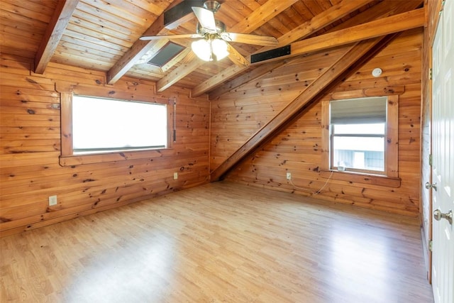 additional living space featuring a wealth of natural light, wood ceiling, vaulted ceiling with beams, and wood finished floors