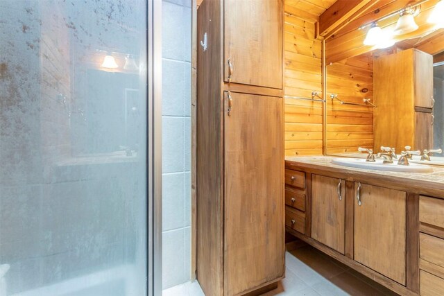 full bath with vanity and a shower with shower door