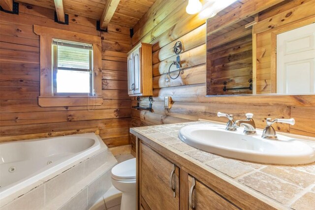 bathroom featuring beamed ceiling, toilet, wood walls, and tiled bath