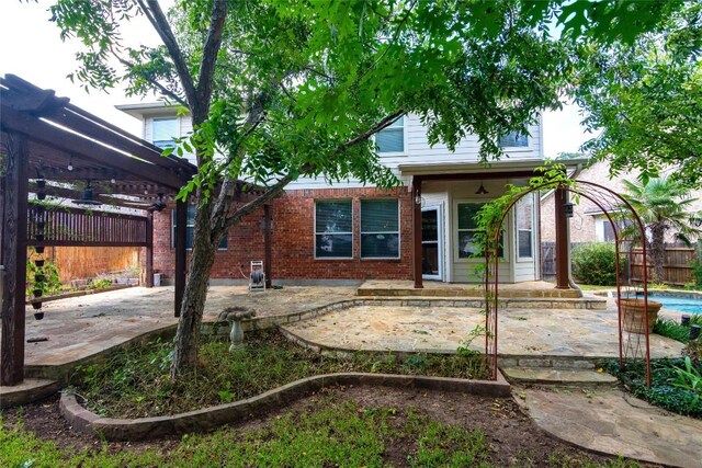 back of house with a patio