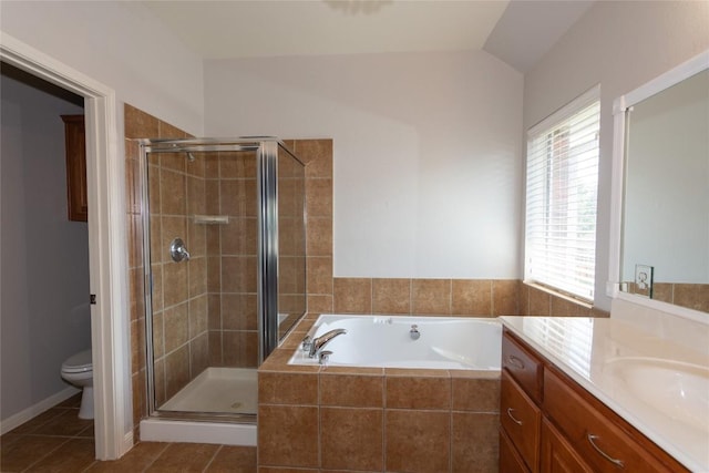 full bathroom featuring lofted ceiling, a healthy amount of sunlight, tile patterned floors, and toilet