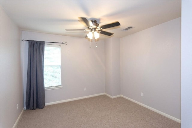 spare room with ceiling fan and carpet floors