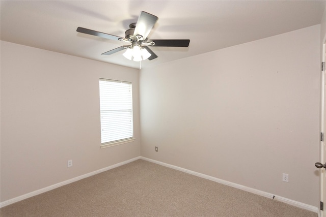 spare room with light carpet and ceiling fan