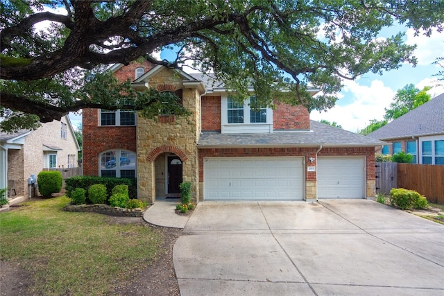 view of front of house featuring a garage and a front yard