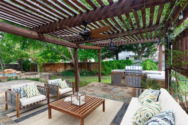 view of patio featuring an outdoor living space, an outdoor kitchen, a grill, and a pergola