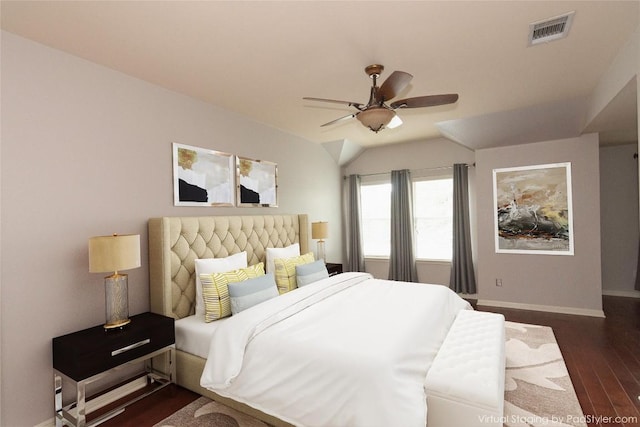 bedroom featuring ceiling fan, lofted ceiling, and dark hardwood / wood-style flooring