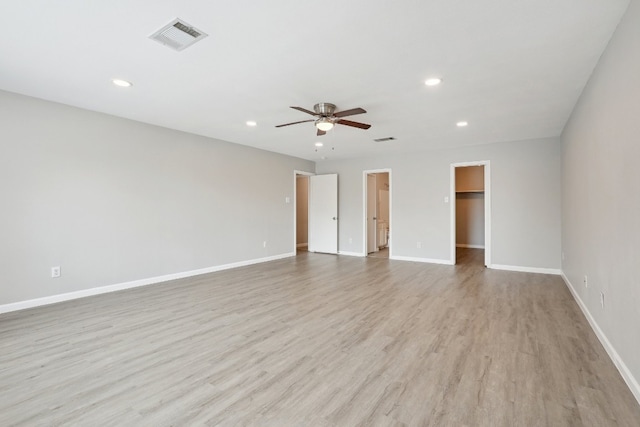 unfurnished room featuring light hardwood / wood-style flooring and ceiling fan