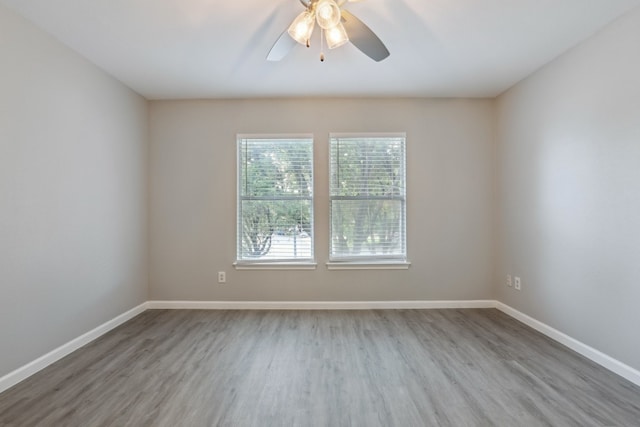 spare room featuring ceiling fan and wood-type flooring