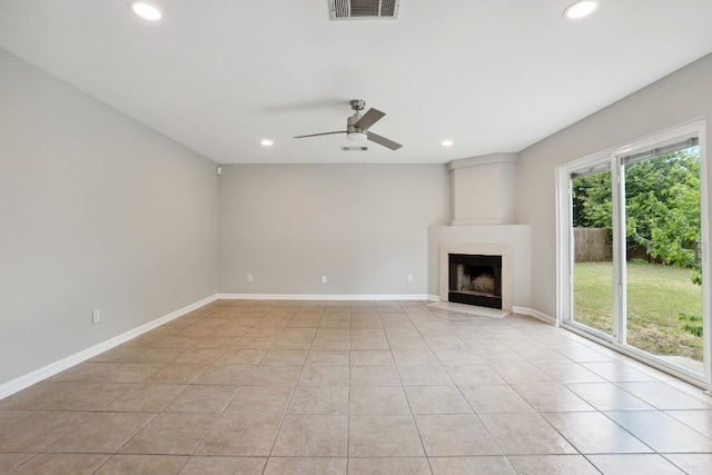 unfurnished living room with light tile patterned floors and ceiling fan