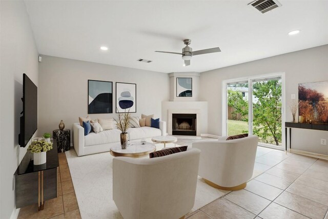 tiled living room with ceiling fan