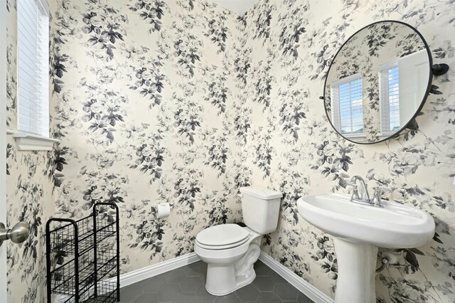 bathroom with tile patterned flooring and toilet