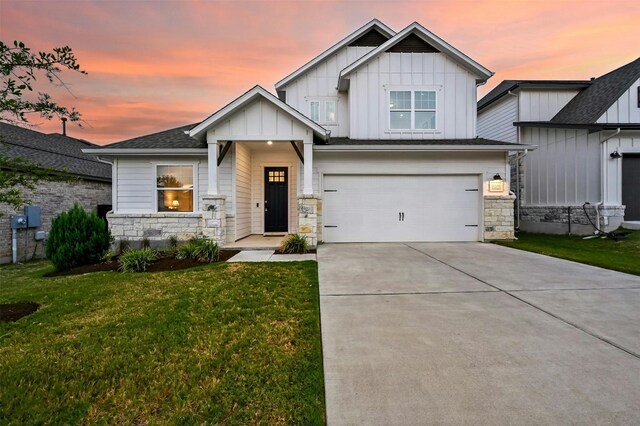 craftsman inspired home featuring a yard and a garage