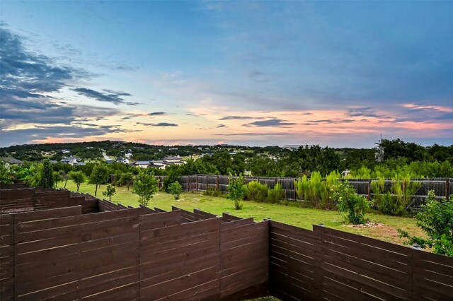 view of yard at dusk