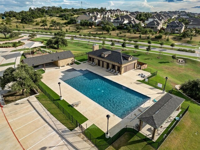 view of swimming pool featuring an outbuilding