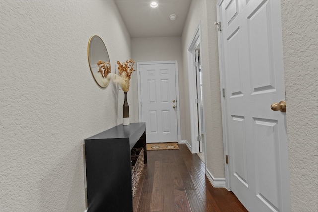 hall with dark hardwood / wood-style floors