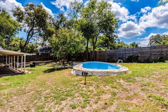 view of pool with a fenced in pool, a fenced backyard, and a lawn