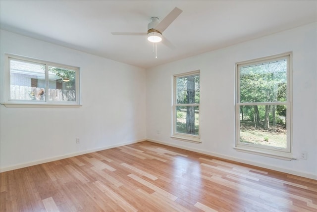 spare room featuring light wood-type flooring and ceiling fan