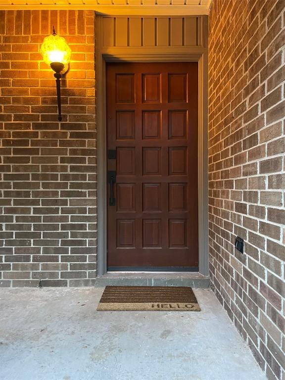 entrance to property with brick siding