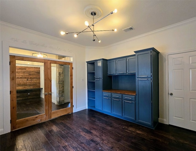 interior space featuring wood counters, dark hardwood / wood-style flooring, crown molding, and blue cabinetry