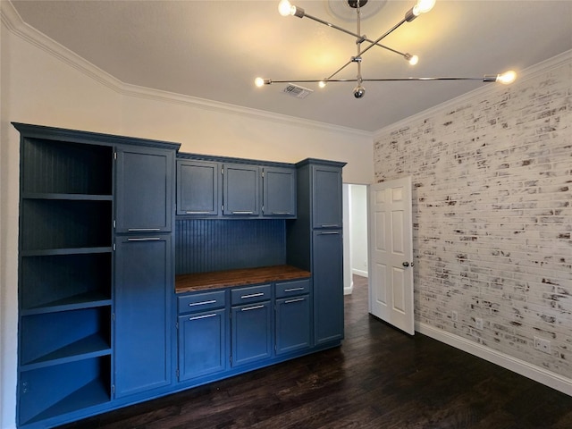 kitchen with ornamental molding, blue cabinets, wooden counters, and dark hardwood / wood-style floors