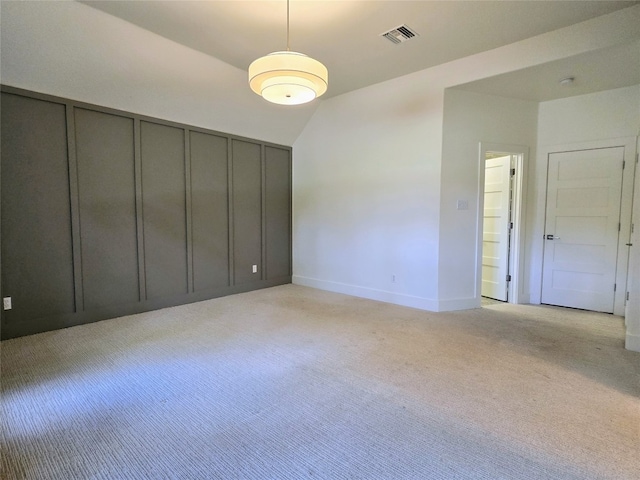 unfurnished bedroom featuring light carpet