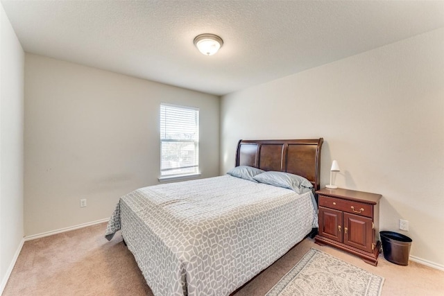 bedroom with light carpet