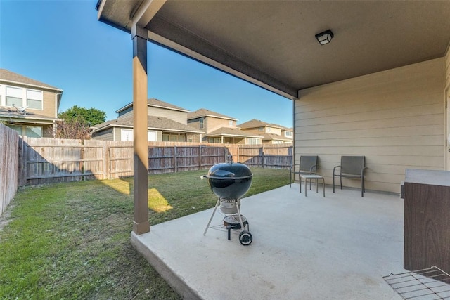 view of patio / terrace with a fenced backyard and a residential view