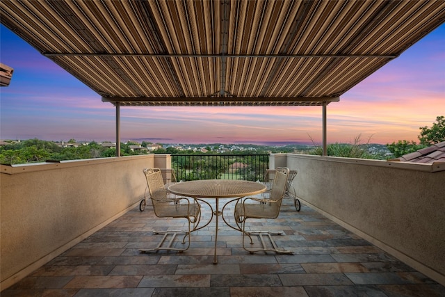 view of patio terrace at dusk