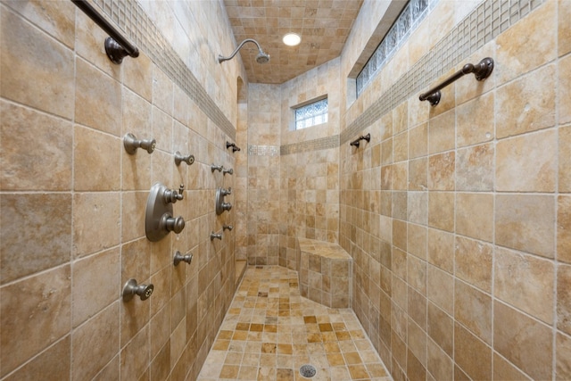 bathroom with a tile shower