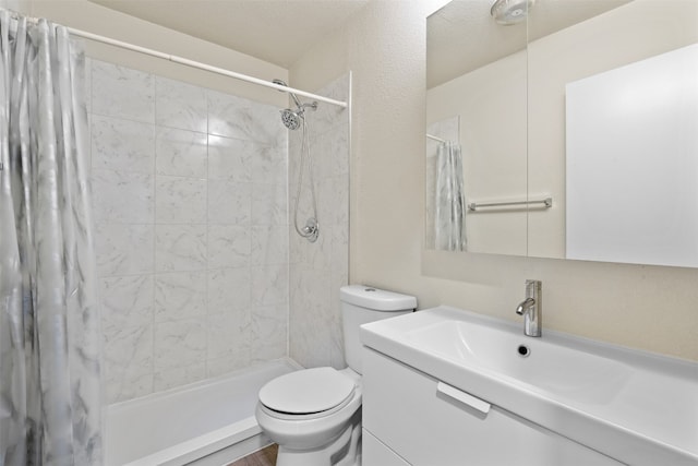 bathroom featuring vanity, toilet, and a shower with shower curtain