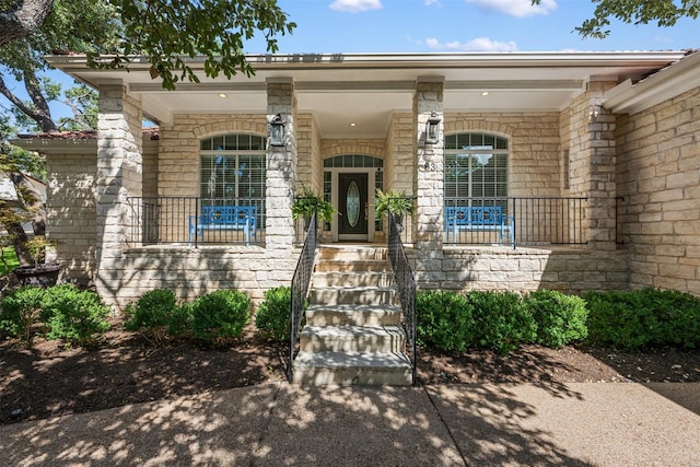 property entrance featuring a porch