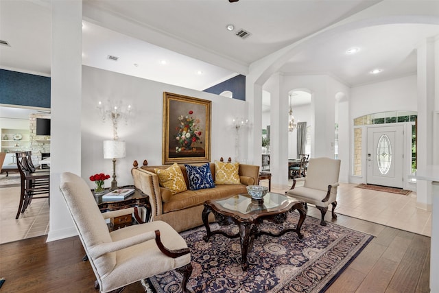 living room featuring an inviting chandelier and hardwood / wood-style floors