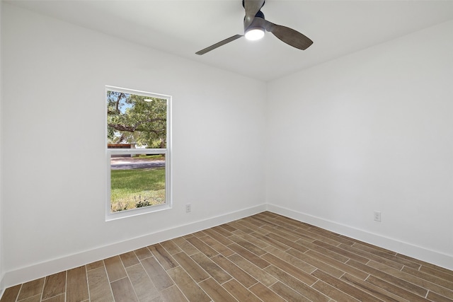 unfurnished room with dark hardwood / wood-style flooring and ceiling fan