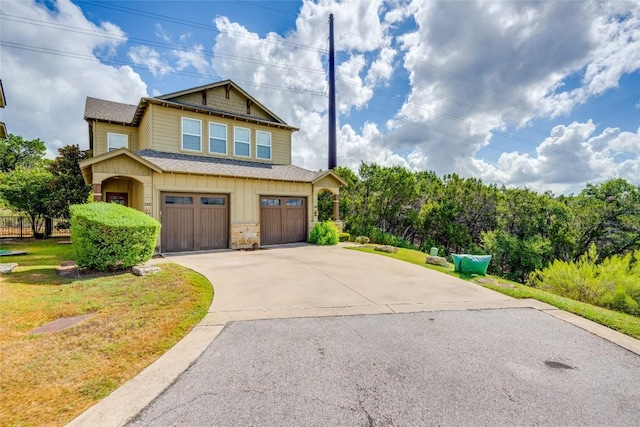 view of front facade with a garage and a front yard