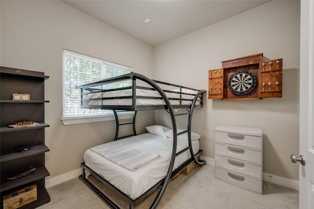 bedroom featuring light carpet