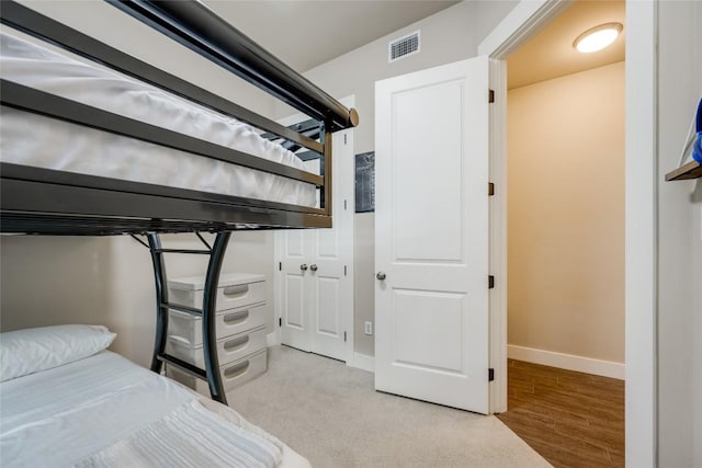 bedroom with light hardwood / wood-style floors