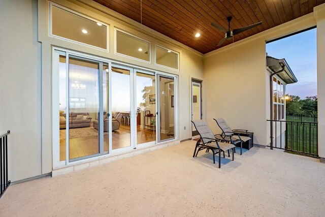 patio terrace at dusk with ceiling fan