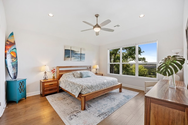 bedroom featuring ceiling fan and light hardwood / wood-style floors