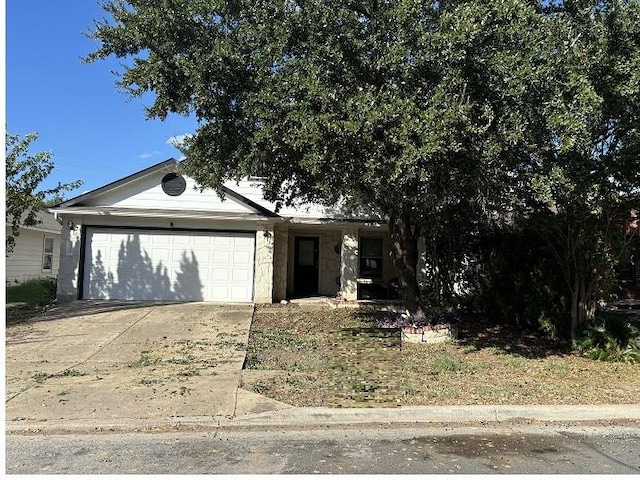 view of front of house with an attached garage and driveway