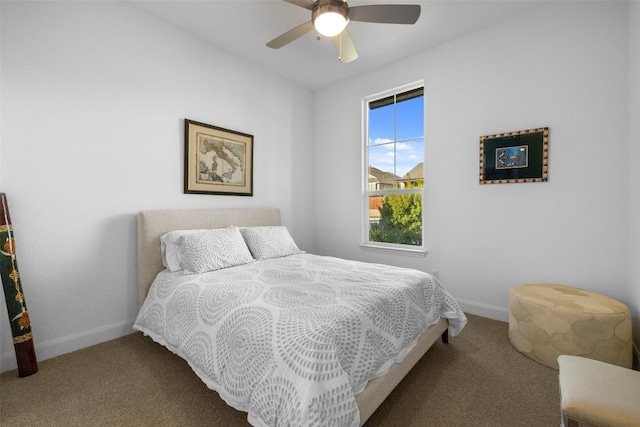 carpeted bedroom featuring ceiling fan and baseboards