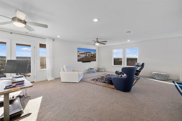 living room featuring a ceiling fan, recessed lighting, carpet flooring, and visible vents