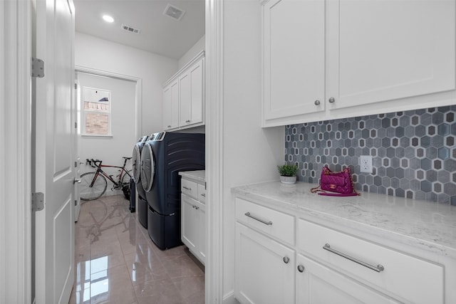 laundry room featuring cabinet space, recessed lighting, visible vents, and independent washer and dryer