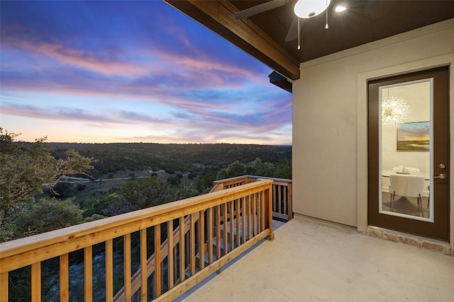 balcony at dusk with a ceiling fan