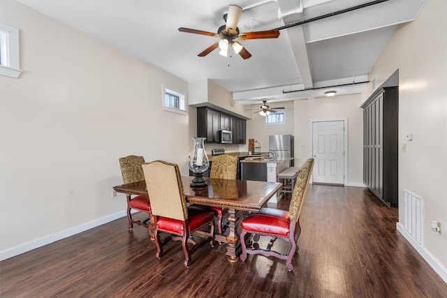 dining area featuring ceiling fan and dark wood-type flooring