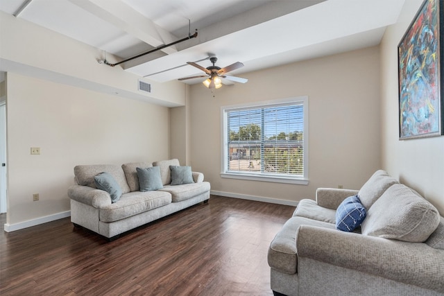 living room featuring ceiling fan, beamed ceiling, and dark wood-type flooring