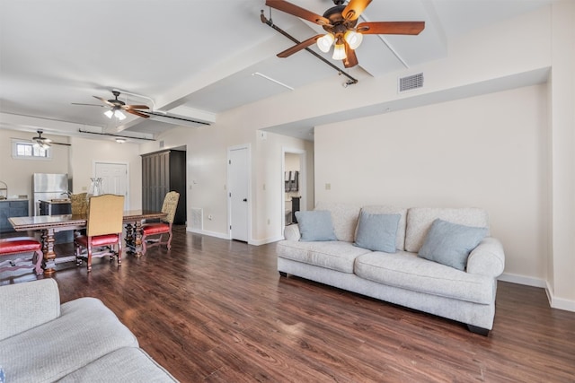 living room with dark hardwood / wood-style flooring and ceiling fan