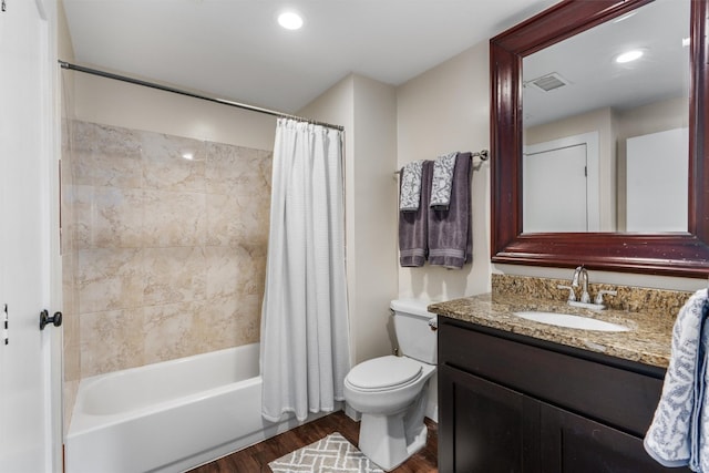 full bathroom with wood-type flooring, vanity, toilet, and shower / bath combination with curtain