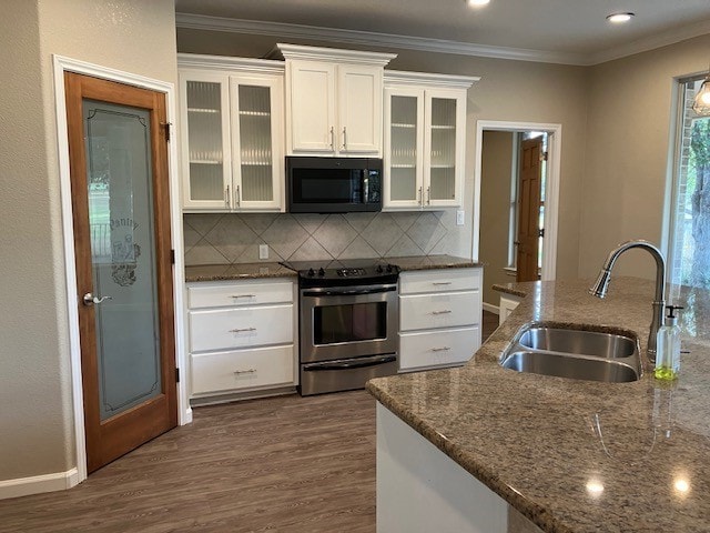 kitchen with backsplash, white cabinetry, sink, stainless steel range with electric stovetop, and dark wood-type flooring