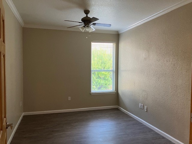 unfurnished room with crown molding, dark hardwood / wood-style flooring, ceiling fan, and a textured ceiling