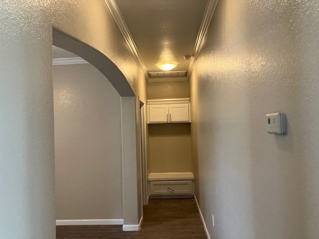 hall with dark hardwood / wood-style floors and crown molding